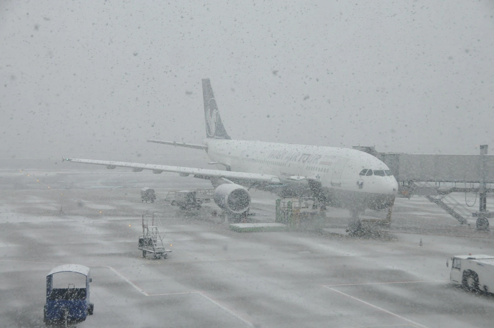 Snowfall in Istanbul leads to reduced flights and snow-covered Istanbul Airport.