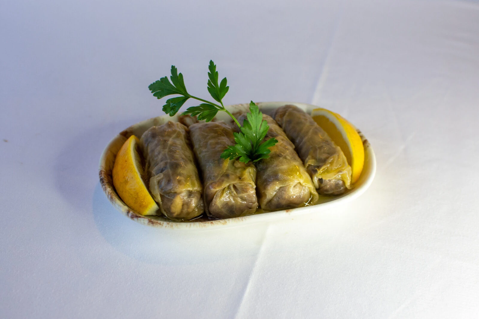 A plate of delicious cabbage rolls, known as Lahana Sarma in Turkish, filled with seasoned rice and meat.