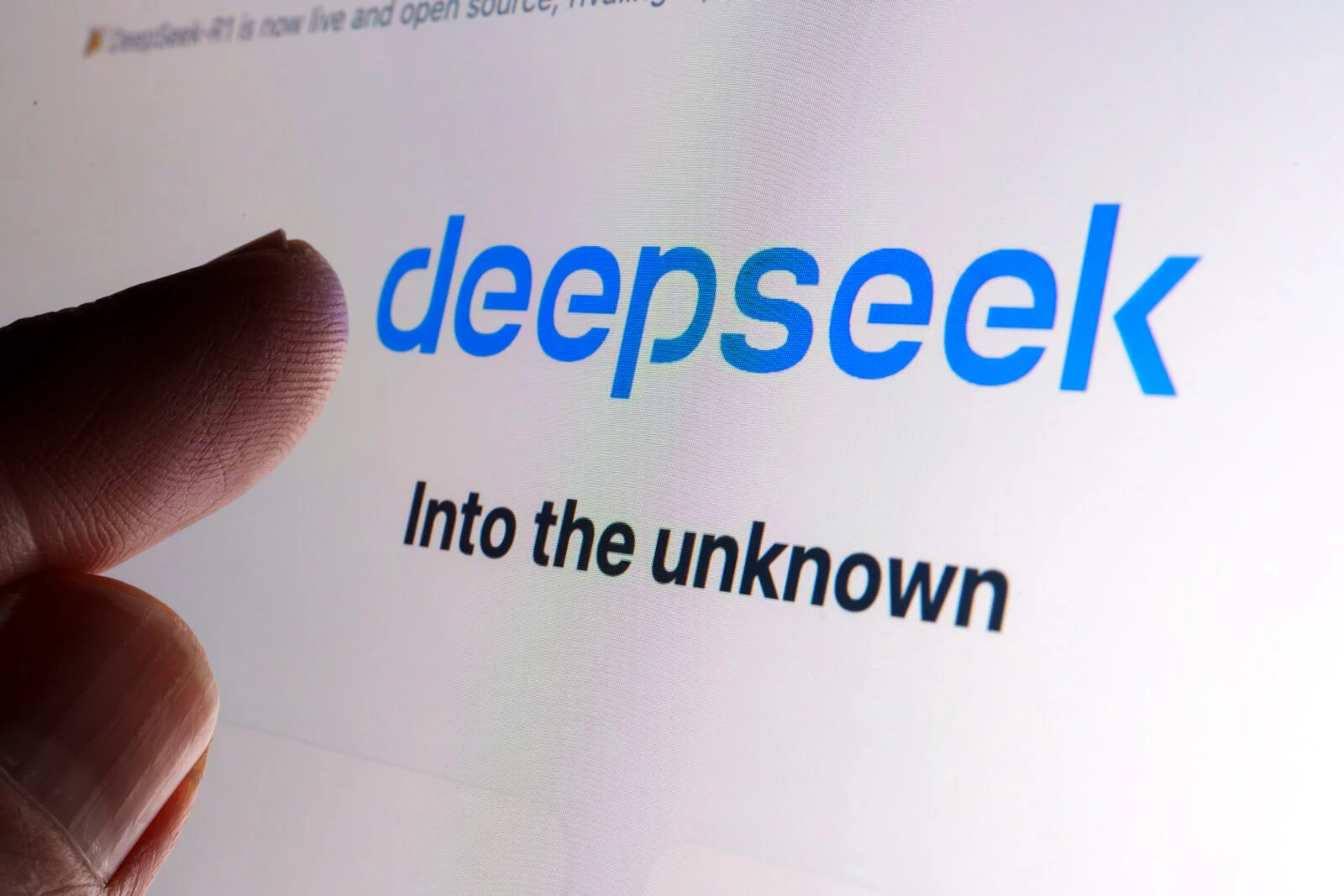 DeepSeek AI company logo seen on the screen and the finger touching it. Stafford, United Kingdom, January 26, 2025