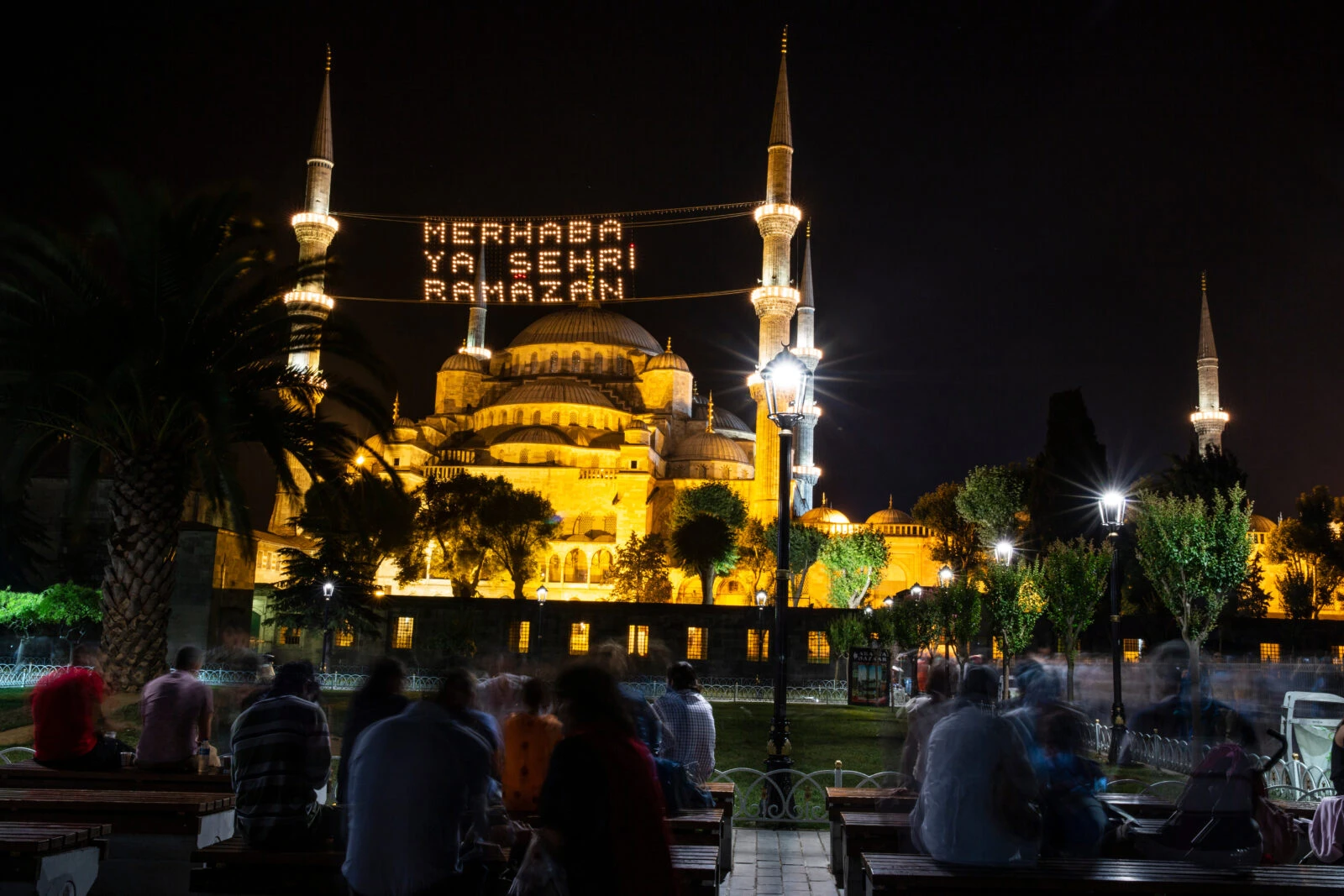 The Blue Mosque glows at night with Ramadan messages welcoming visitors to this spiritual season.