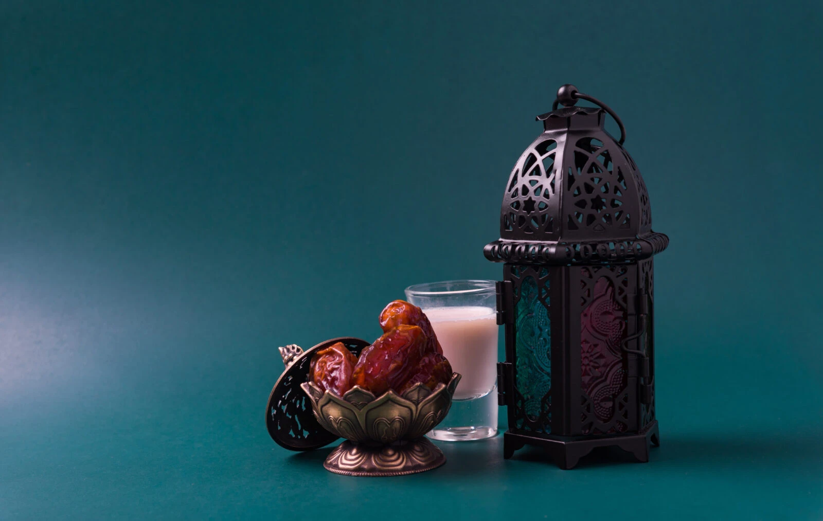 A symbolic Ramadan setting with dates, milk, and a traditional lantern, representing the essence of iftar.