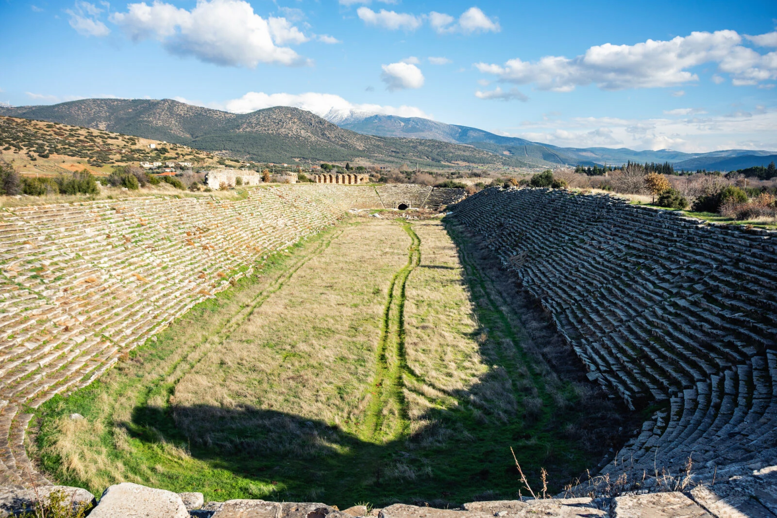 The iconic Aphrodisias Stadium in Aydin, Türkiye, showcasing its semi-circular seating.