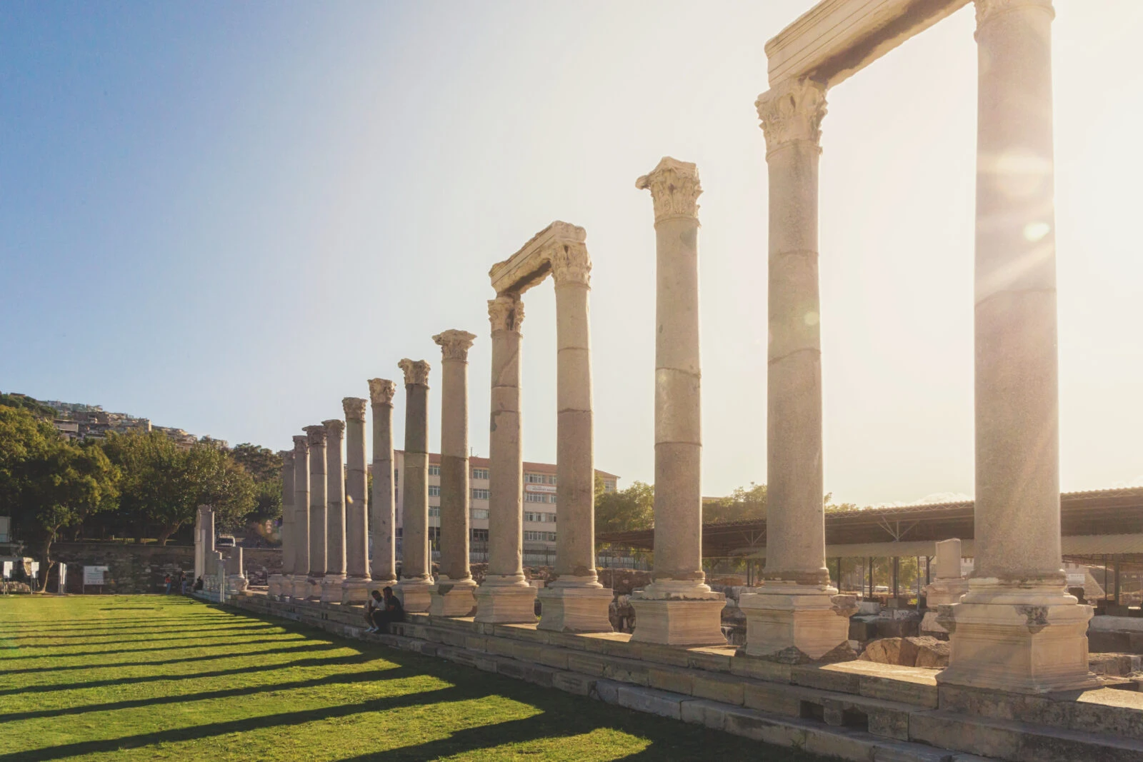 The colonnade of the ancient Agora in Smyrna, illuminated by the summer sunset light, in Izmir, Türkiye.