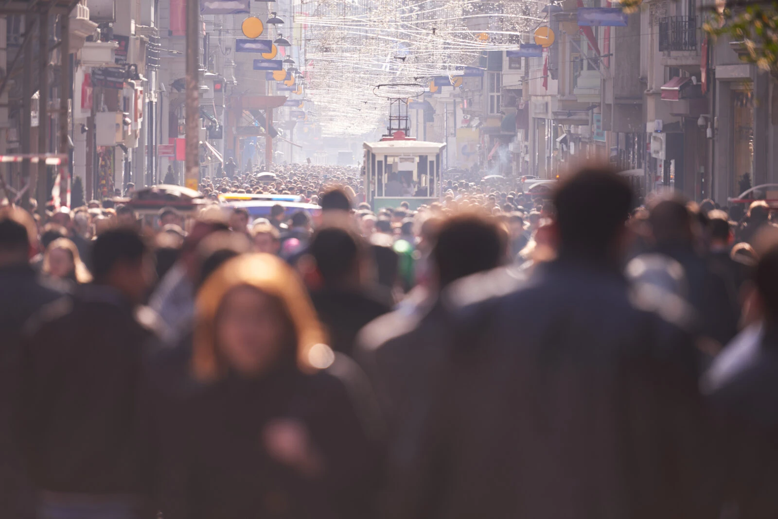 people crowd walking on busy street on daytime - Discouraged workers