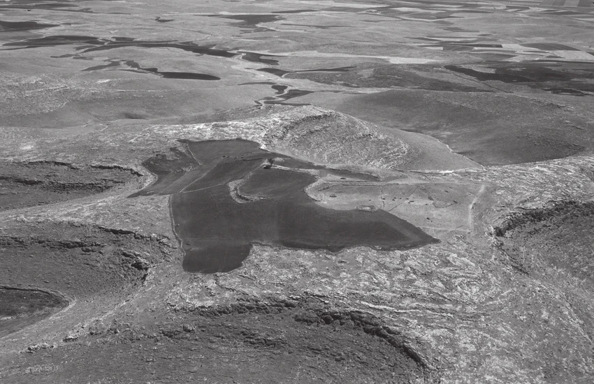 Aerial photograph of Gobeklitepe before excavations started, showing untouched terrain and natural landscape.