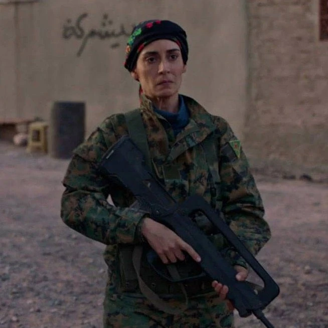 A photo collage featuring Melisa Sozen in a PKK/YPG uniform from the French drama series Le Bureau des Légendes. The image on the left shows her in character, while the collage is credited to OdaTV.