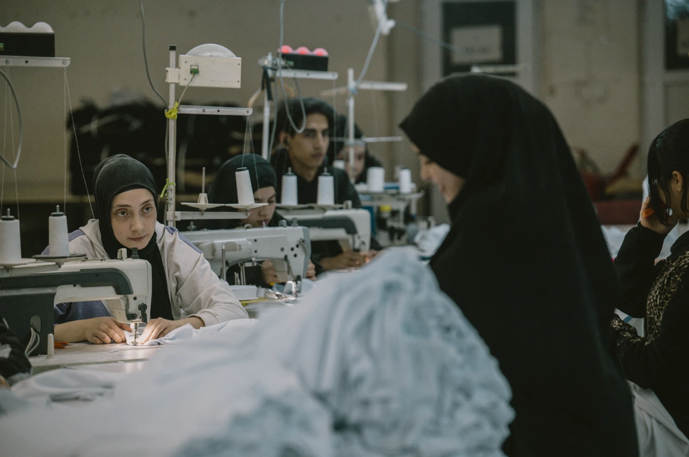 Photo shows muslim syrian women working in textile sector in TUrkey