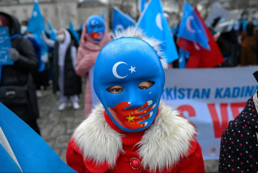 Photo shows an uyghur child wearing a anti-china protest mask