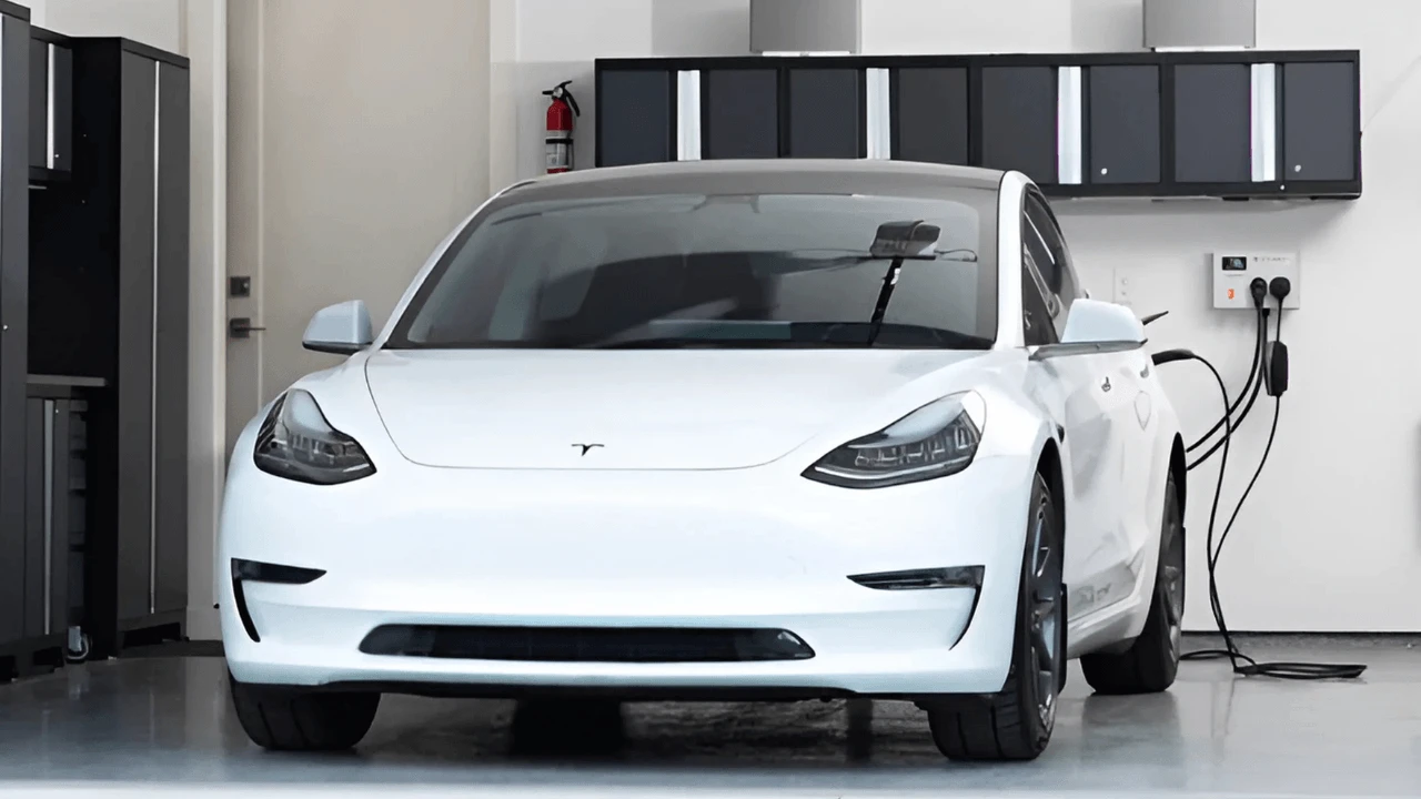 A Tesla electric vehicle being charged