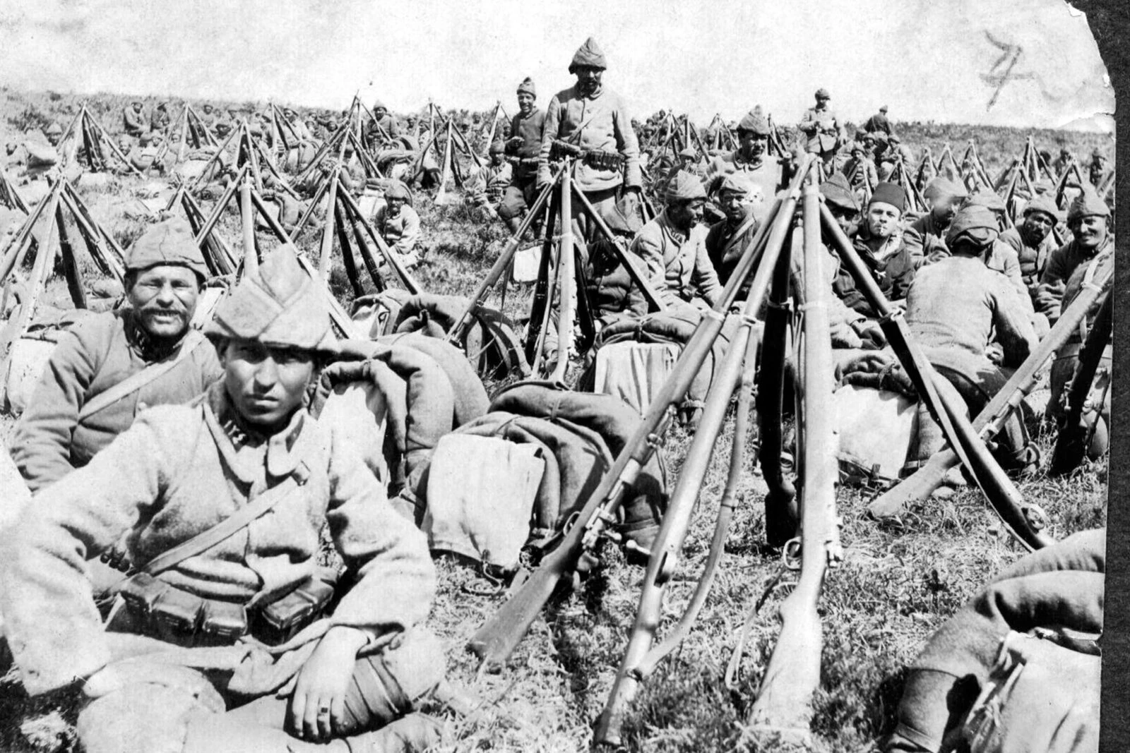 A historical photograph showing the Ottoman army engaged in battle during the Çanakkale campaign, demonstrating their determination and resilience. - Canakkale Victory