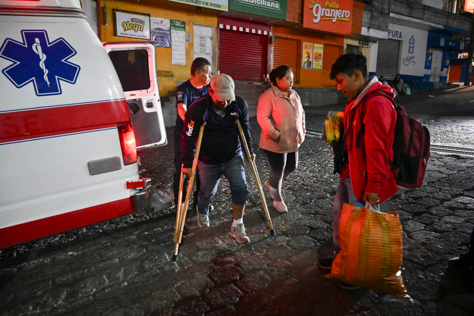 Evacuees arrive at a shelter after fleeing their village affected 