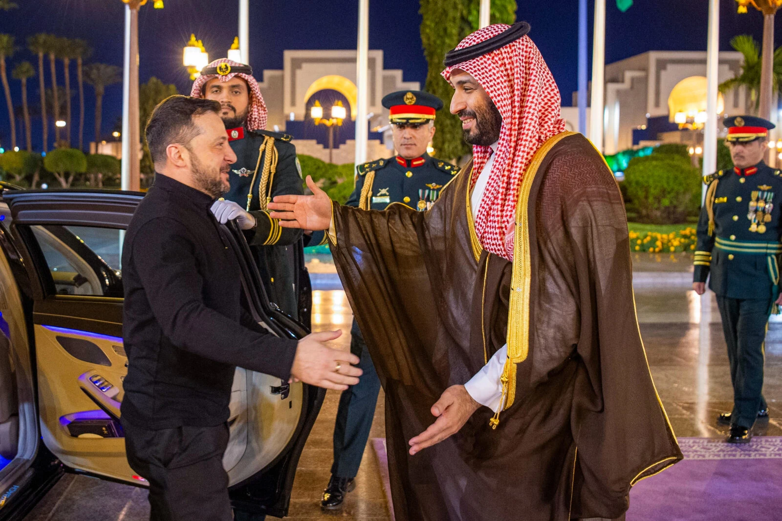  Saudi Crown Prince Mohammed bin Salman (R) greeting Ukraine's President Volodymyr Zelenskyy