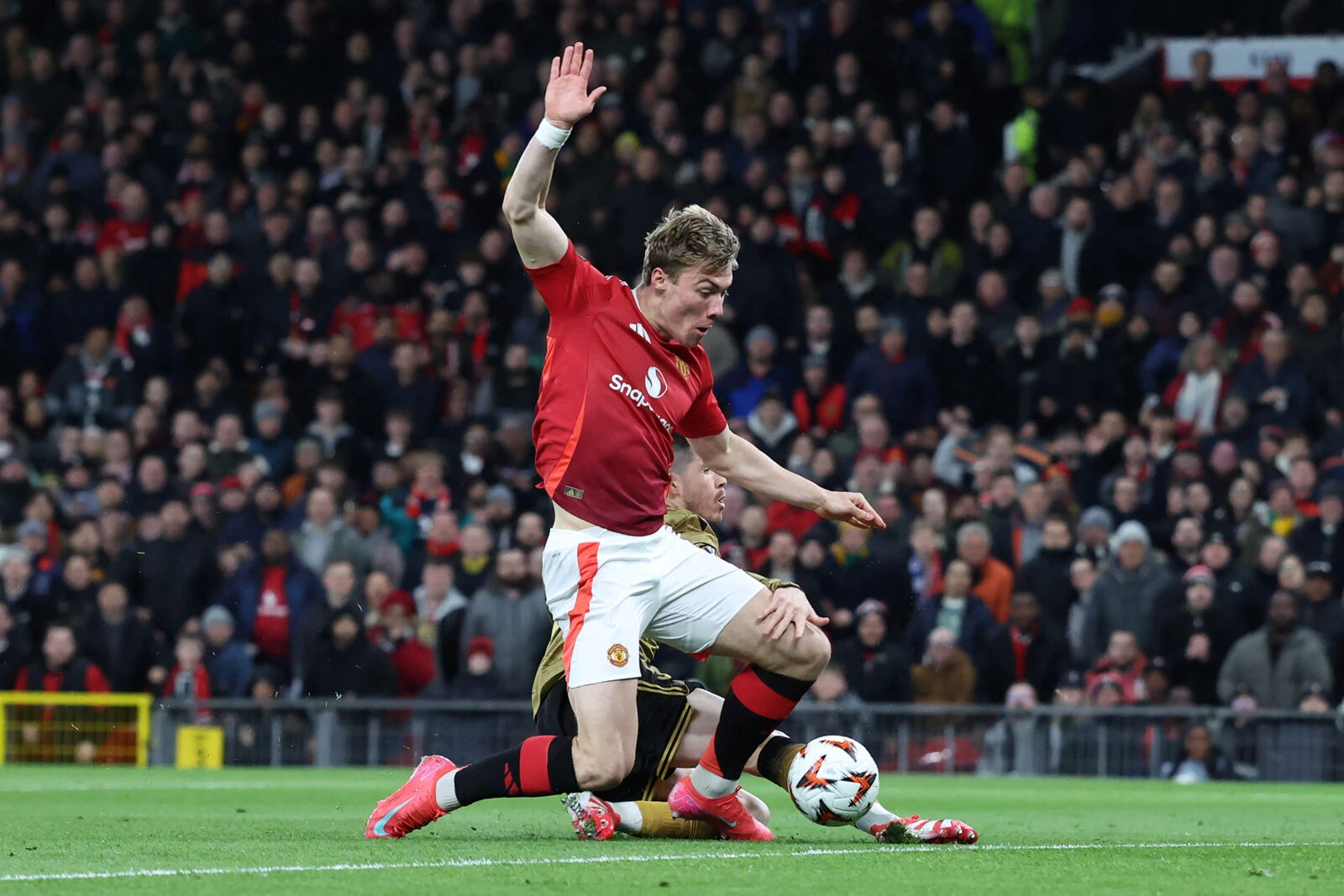 Real Sociedad's Spanish midfielder #05 Igor Zubeldia fouls Manchester United's Danish striker #09 Rasmus Hojlund 