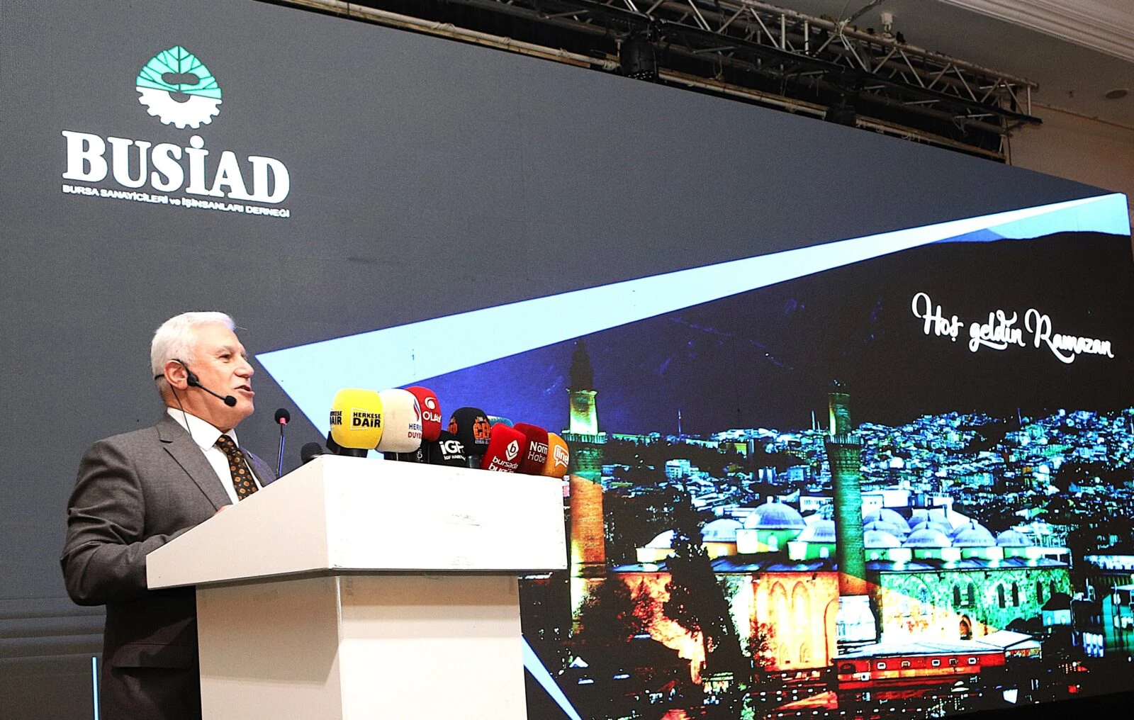 Mustafa Bozbey, Mayor of Bursa, delivering a speech at a podium.