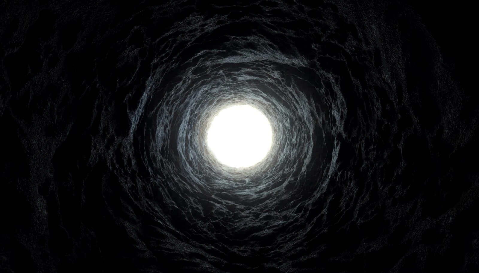 A dark tunnel with a bright circular opening, visually representing deep-space phenomena like black holes and extreme cosmic events.