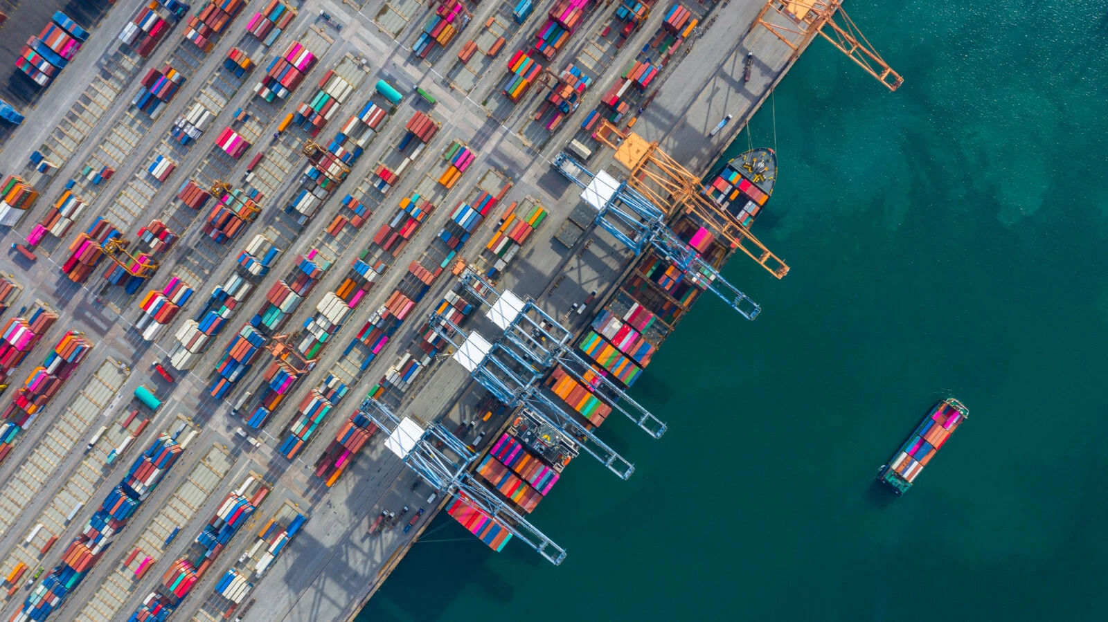 Aerial view cargo ship terminal, Unloading crane of cargo ship 