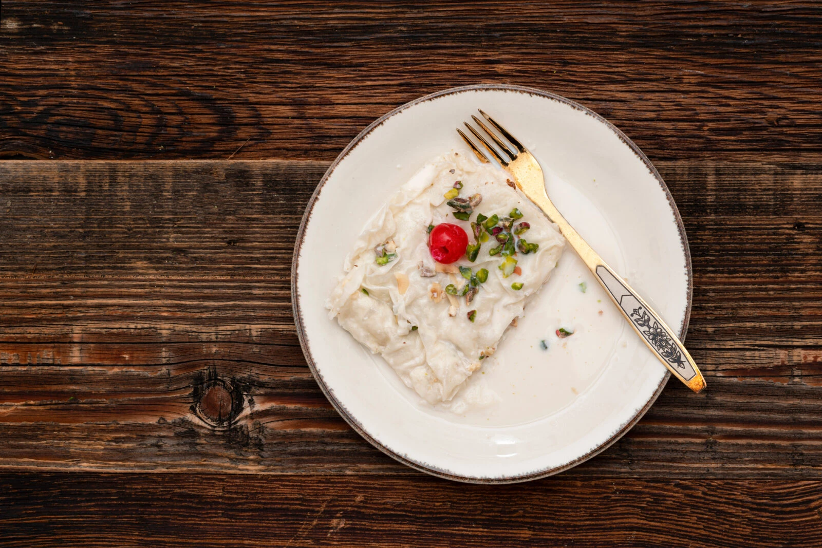 Turkish traditional Ramadan dessert gullac on the table.