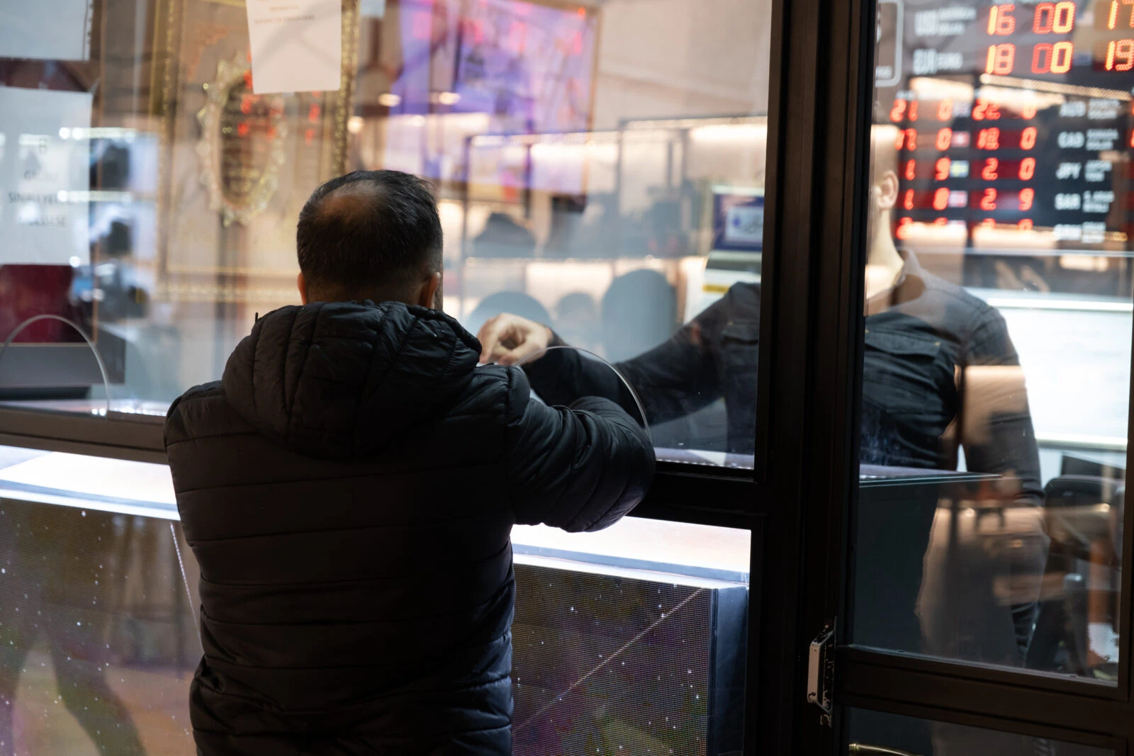 Man exchanging money at a currency exchange office