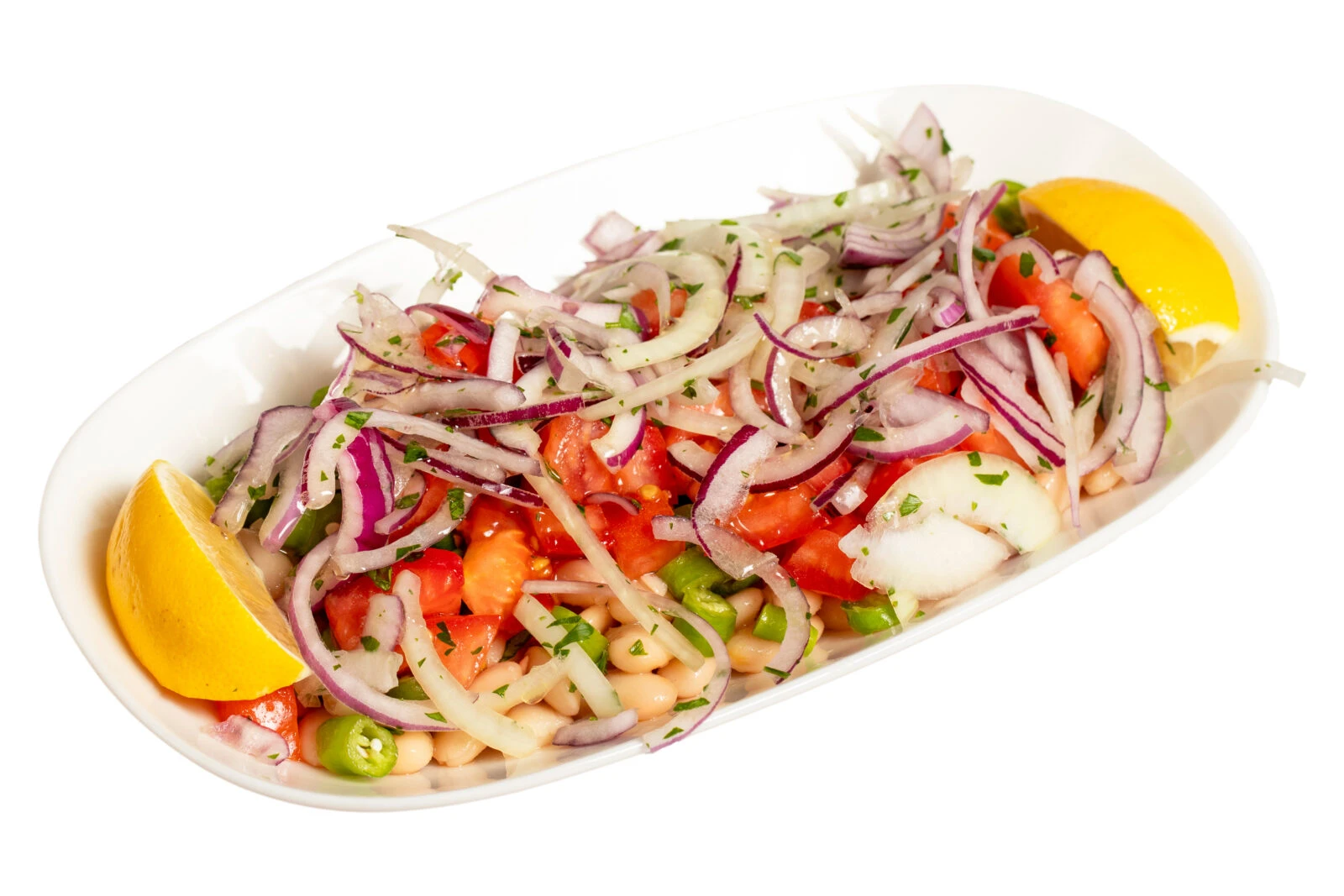 A traditional Turkish piyaz salad made with white beans, red onions, tomatoes, and fresh parsley, garnished with lemon slices.