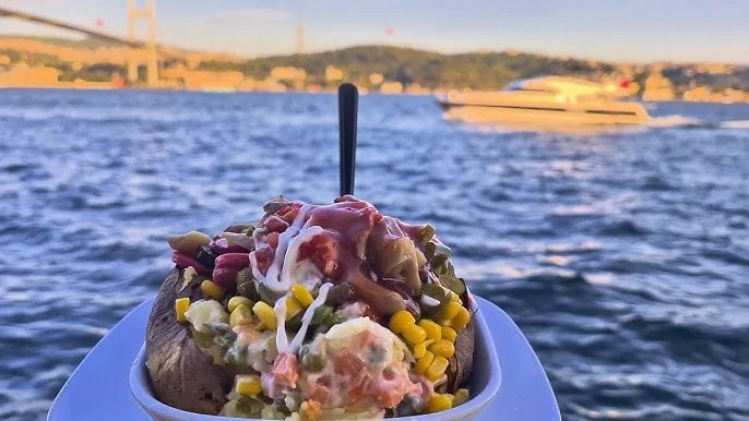 A loaded kumpir in Ortaköy with a breathtaking view of the Bosphorus.