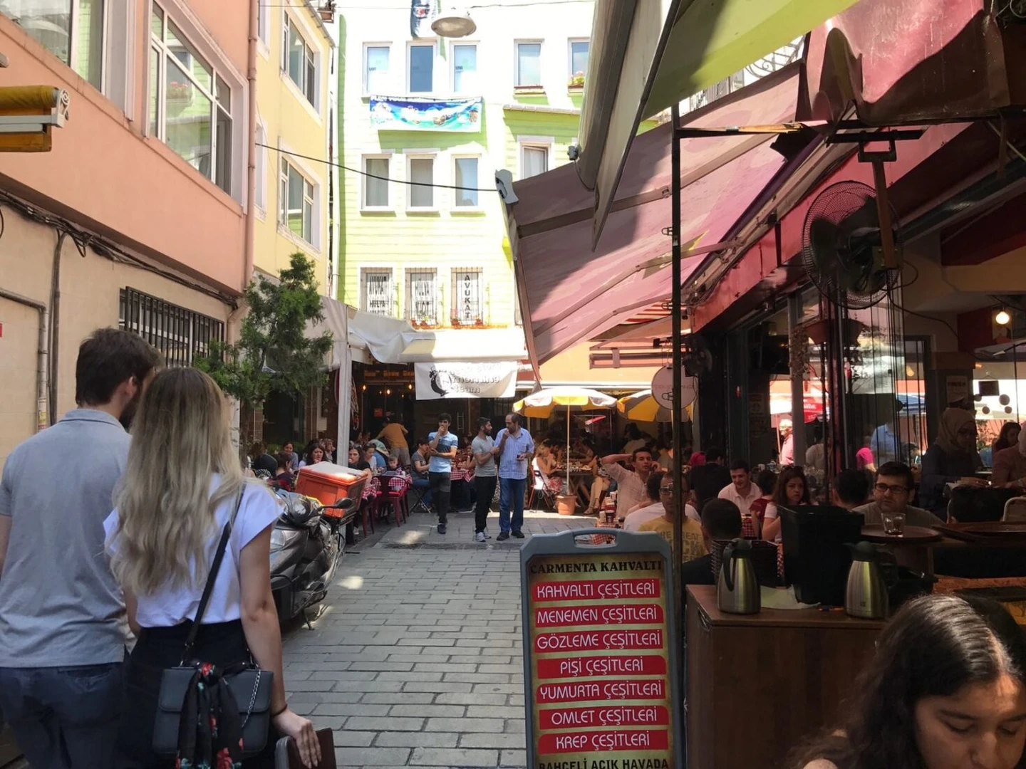 A lively street in Besiktas, Istanbul, lined with popular breakfast cafés.