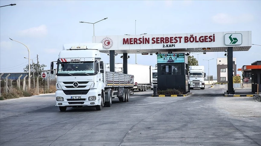 A white truck passes through an entrance gate