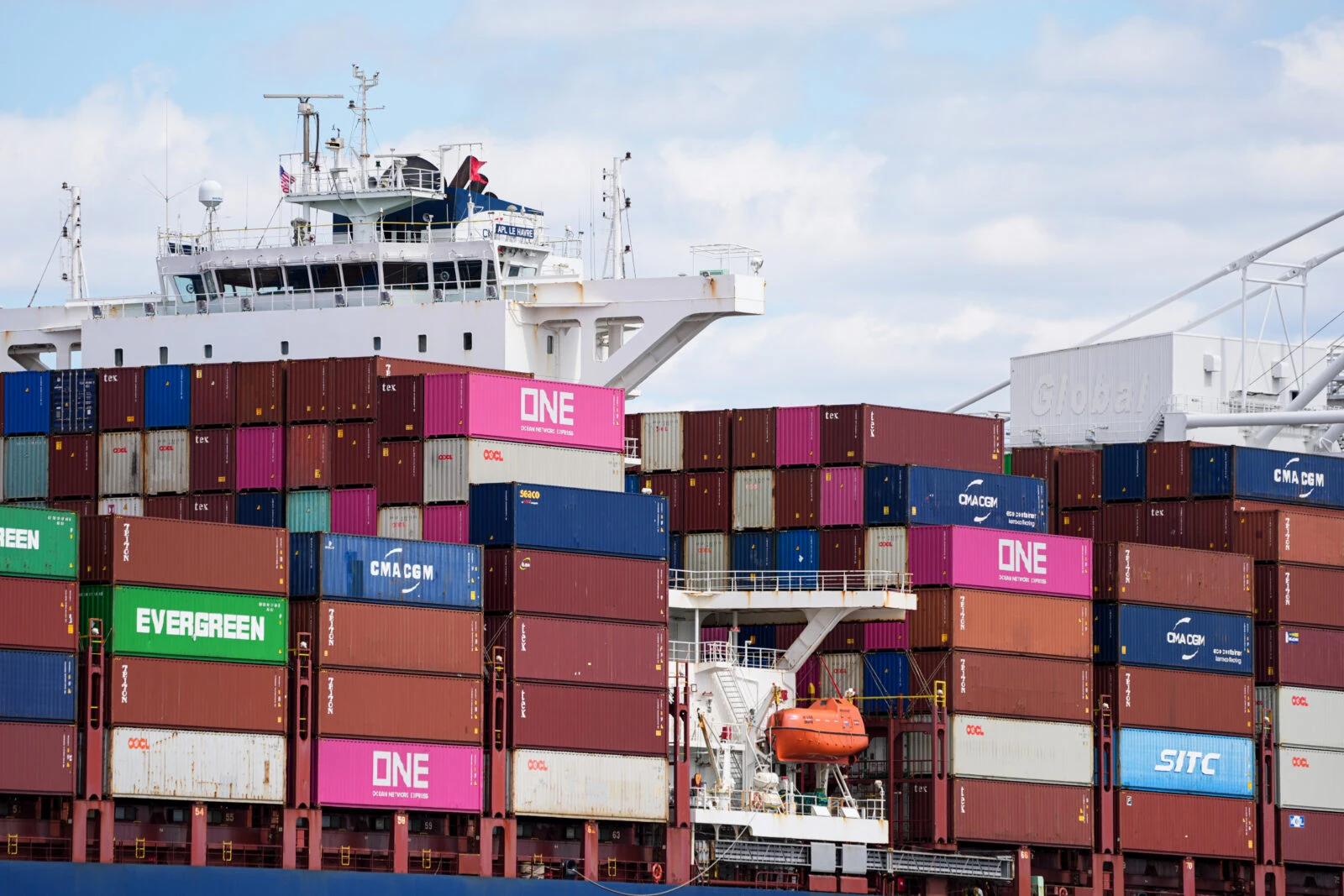 US quietly reaches out to China over trade deal: Chinese media 3 Cargo ship loaded with colorful shipping containers at port
