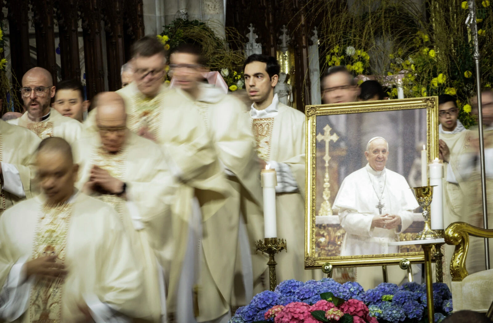 Vatican prepares farewell for Pope Francis, global leaders to attend 3 Clergy walk past a picture of the late Pope Francis during a mass at St. Patrick's Cathedral in New York, U.S., April 22, 2025 (AFP Photo)