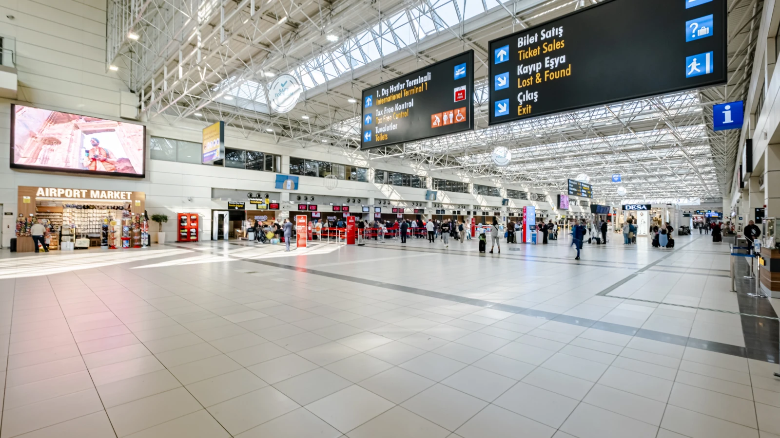 People walk through spacious check-in hall