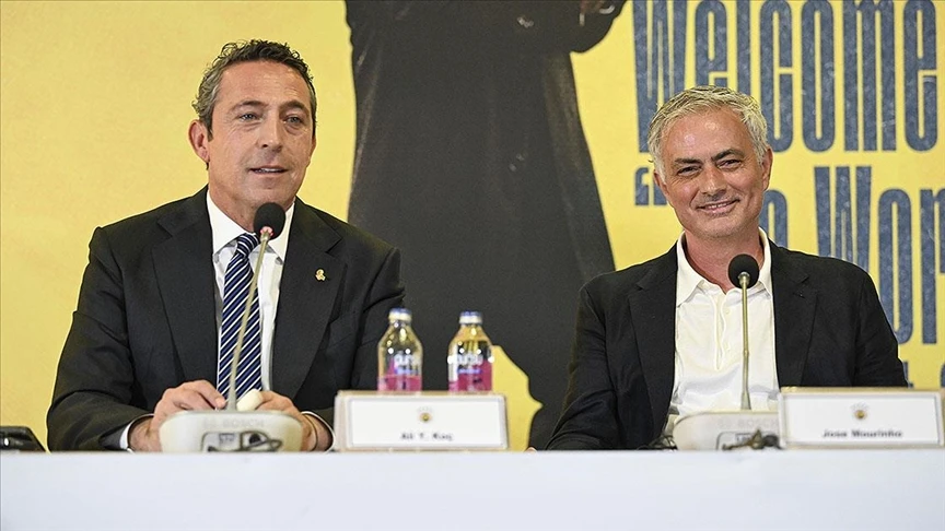 Ali Koc and Jose Mourinho seated at press conference