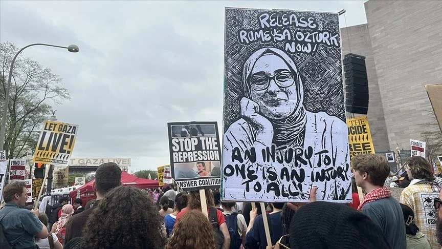 Hearing for Turkish student Rumeysa Ozturk postponed to May 20 4 Photo shows a protester holding a photo of Turkish Tufts University student Rumeysa Ozturk, with a sign that reads: "An injury to one is an injury to all"