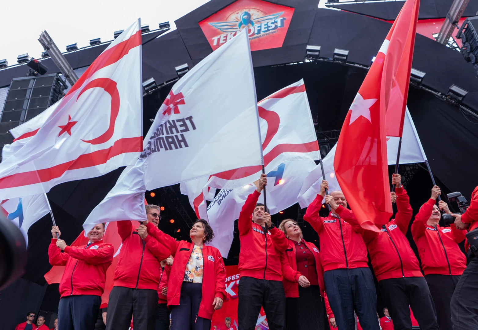 AI and high technology pave the way for a new era: Teknofest head 5 Photo shows people holding Turkey's and Turkish Cyprus' flags.